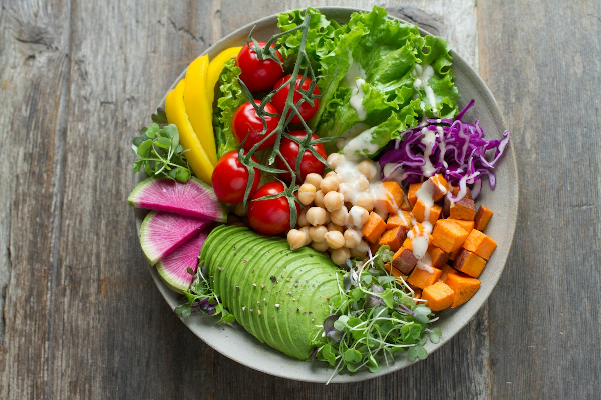 A colorful plate of fresh vegetables and greens