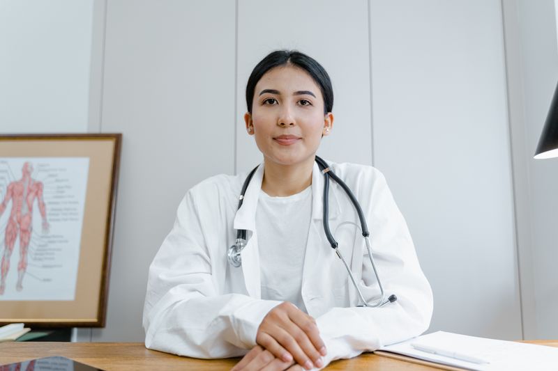 Helena Cho seated at a clinic desk