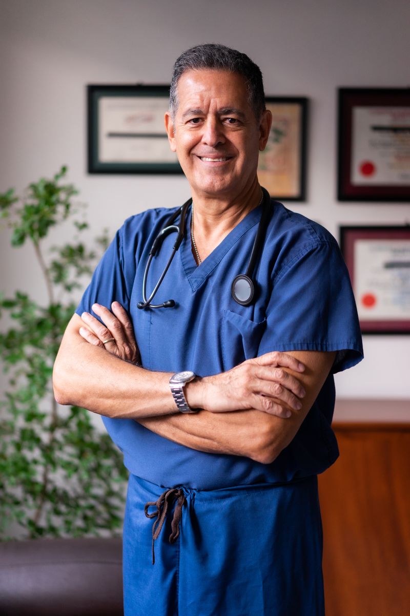 Mateo Alvarez in blue clinical scrubs